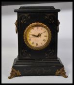 A vintage 20th century ebonised mantle clock havin