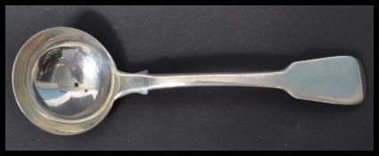 A hallmarked silver 19th century Georgian ladle in the fiddle pattern by Jonathan Hayne . Hallmarked