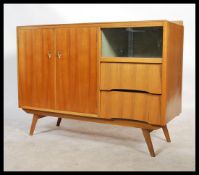 Avalon Yatton - A mid 20th Century teak wood sideboard of good proportions having a beehive style