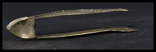 A 19th century Victorian pair of silver plated sardine holders in the form of fish with chased