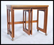 A retro 1970's Mcintosh of Kirkcaldy Scottish teak wood nest ot tables. The rectangular main table