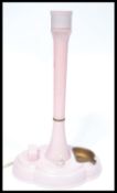 A vintage 20th century Art Deco bakelite bedside table lamp in a stunning pink colour way, raise