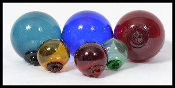 A group of six vintage 20th century Witches balls.