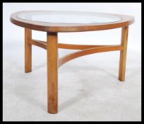 A mid 20th Century shaped triangular teak coffee table, inset with glass top, shaped rectangular