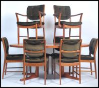 A 1960's retro 20th century Macintosh of Kirkcaldy teak dining suite comprising extending dining tab