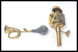 A vintage style brass carriage lamp together with vintage style brass and rubber horn / hooter.