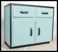 A vintage mid 20th Century enamel topped two tone kitchen two drawers above aluminium cupboard