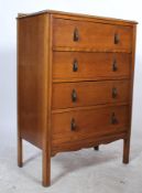 A vintage mid 20th Century oak straight chest of four graduating drawers, fitted with brass