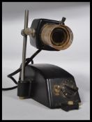 An unusual mid 20th century retro scientific / Industrial projector lamp with raised lamp on metal
