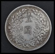 An early Chinese Republic period 1914 ' Fat Man ' one dollar coin having the rare L. Giorgi