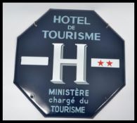 A French 20th century enamel painted metal advertising sign with blue ground and details for Hotel