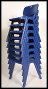 A set of eight retro style stacking chairs in the manner of Kartell, each chair moulded in a