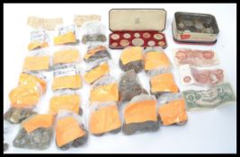 A collection of coins dating from the 19th century to include coins from all around the world,