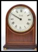 A good quality mahogany inlaid Comitti of London dome top mantel clock with roman numeral dial and