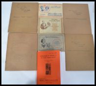 A collection of early 20th century cigarette cards in albums to include Players Uniforms of the