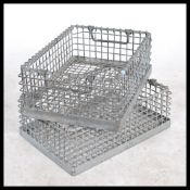 A pair of vintage industrial french stacking trays being of weaved galvanized steel wire mesh