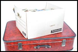 Postcard hoard. Housed in large suitcase and archive box. Huge quantity in the region of 8,500.