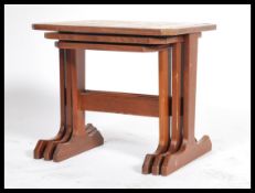G-Plan - A set of three retro 20th Century teak wood tiled top nest of graduating tables raised on
