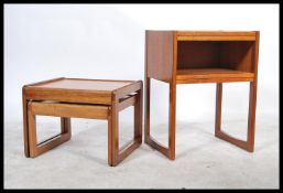 A 1970's retro teak wood twin nest of tables in the Danish manner together with another teak wood