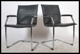 A pair of retro style  chrome cantilever elbow chairs with original black leatherette back and