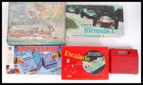 A collection of vintage board games to include a Waddingtons Formula 1 game , a Railroader ,