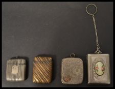 A 20th century sovereign holder along with a silver plated vesta case , brass readed vesta and