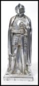 A vintage 20th century novelty table lighter of large proportion in the form of a knight having a