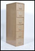 A vintage industrial 20th century metal filing cabinet of slim proportions have a series of