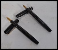 Two vintage fountain pens having 14ct gold nibs a Swan Self Filler example and a Summit example.