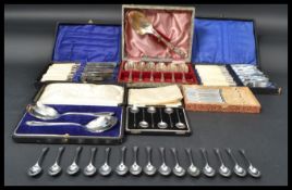 A collection of vintage 20th Century cased flatware to include a set of silver hallmarked coffee