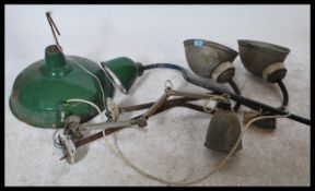 A collection of vintage 20th Century enamel industrial factory lights, to include wall and ceiling