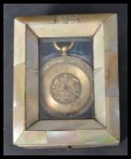 A vintage 18ct gold ladies fob watch with engine turned face and faceted hand ( af ) set with a