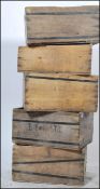 A set of six vintage Sardine style transportation cases, each with a fitted wire band and with