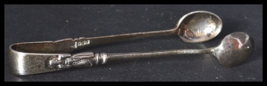 A pair of silver hallmarked Walker and Hall sugar