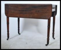 An early 19th century Georgian Pembroke table rais