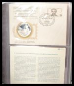 An album of thirty six proof silver medallions mou