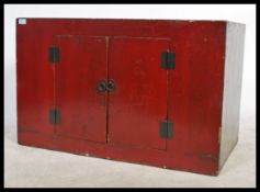 An early 20th Century Chinese plain  red lacquered