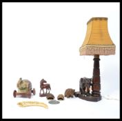 A vintage 20th century carved hardwood lamp modell