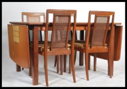 A retro 20th Century G-Plan dining table suite com