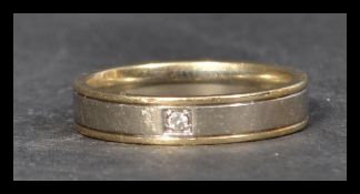 A hallmarked 9ct white and yellow gold and diamond
