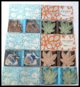 A collection of unusual boxed Wade pairs of dishes