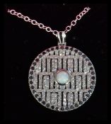 A sterling silver and CZ necklace pendant of round