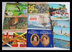 A collection of vintage tea cards in albums and loose along with cigarette cards and a quantity of
