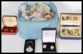 A good collection of vintage costume jewellery to include bracelets , bangles , yellow metal items ,