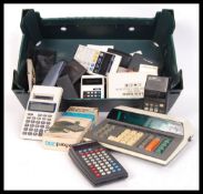 A large collection of vintage 20th Century desktop / pocket and scientific calculator and personal