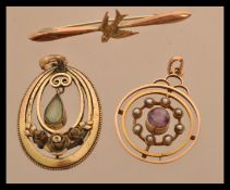 A 9ct gold dove bar brooch along with a 9ct gold amethyst and seed pearl pendant and a yellow