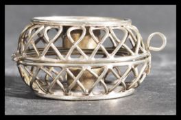 A hallmarked Israel silver campaign folding tea light holder with pictorial of a building to both