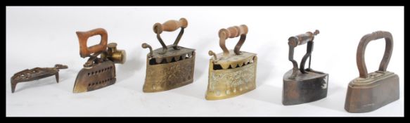 A collection of six irons and trivets dating from the 19th Century of various designs, please