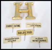 A set of vintage early 20th century food labels on ivorine plaques with sticks reading Selected