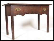 An 18th century Georgian mahogany lowboy writing table desk being raised on squared legs with fitted